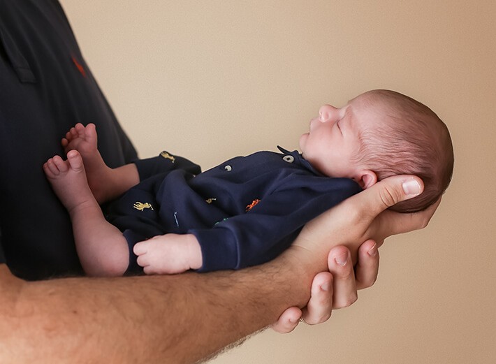 Baby boy in dad's hands