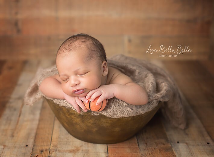 Baby boy with basketball prop