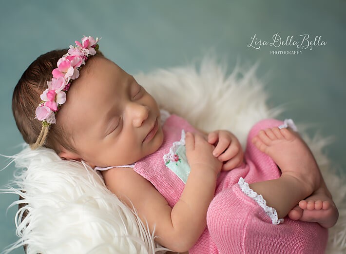 Baby girl in pink romper