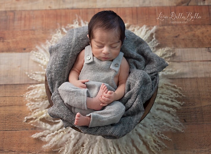 Newborn boy in bowl