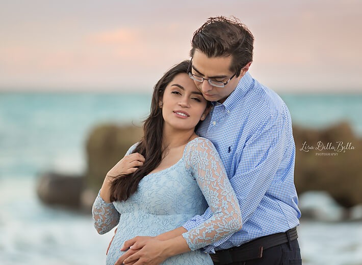 Maternity couple on beach